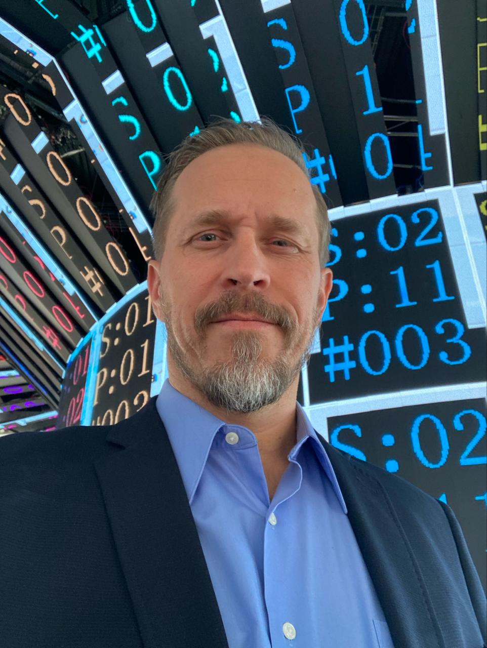 Tero Moliis with a digital presentation background