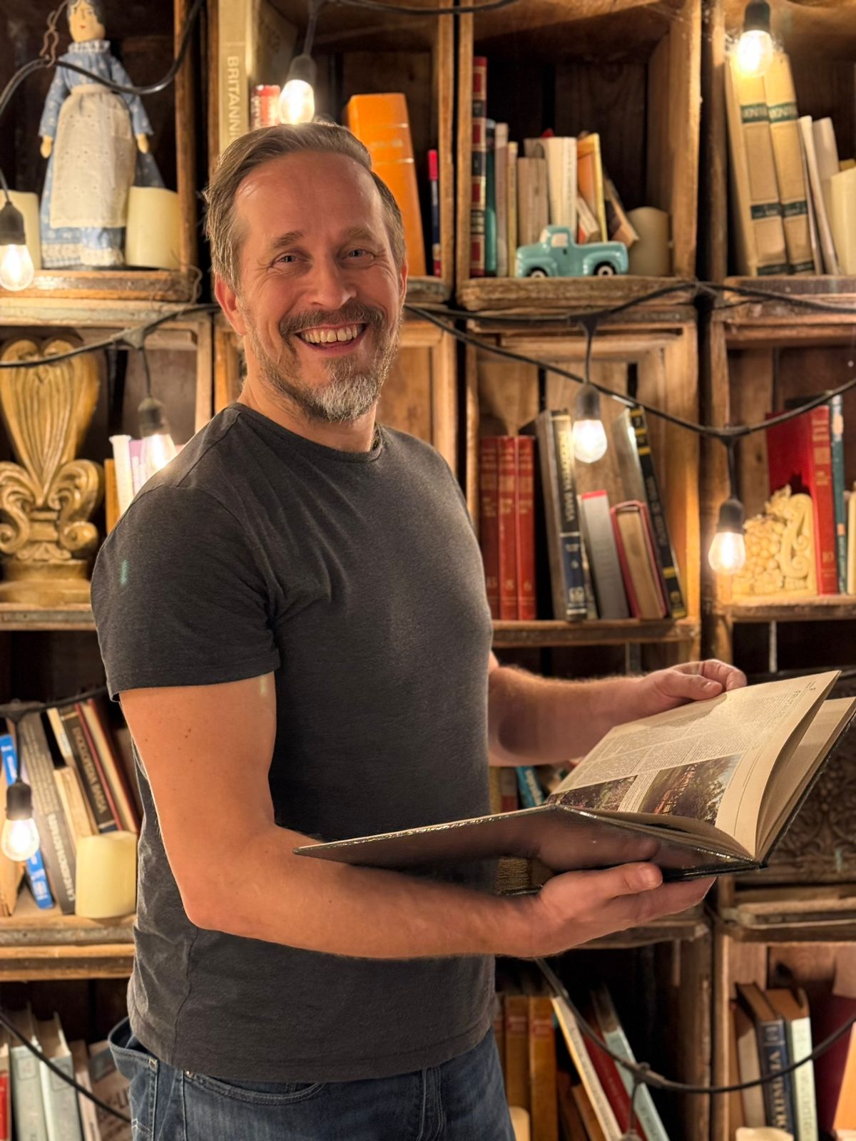 Tero Moliis with bookshelves
